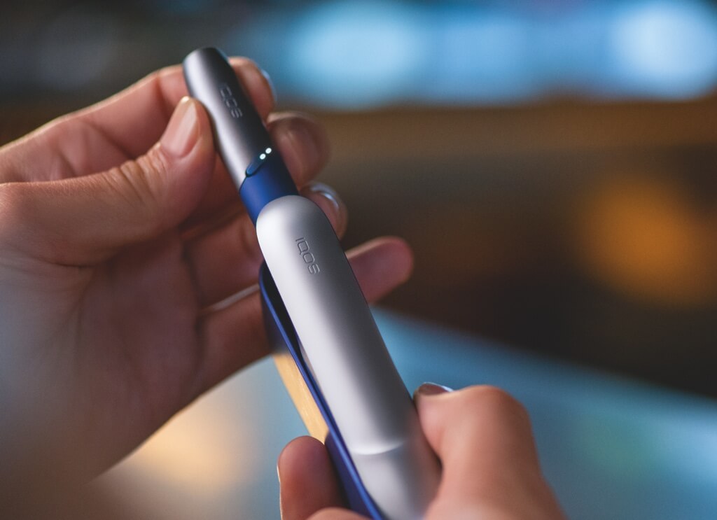 IQOS 3 next to coffee cups