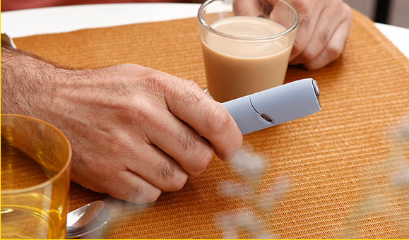 Man Holding IQOS 3 White