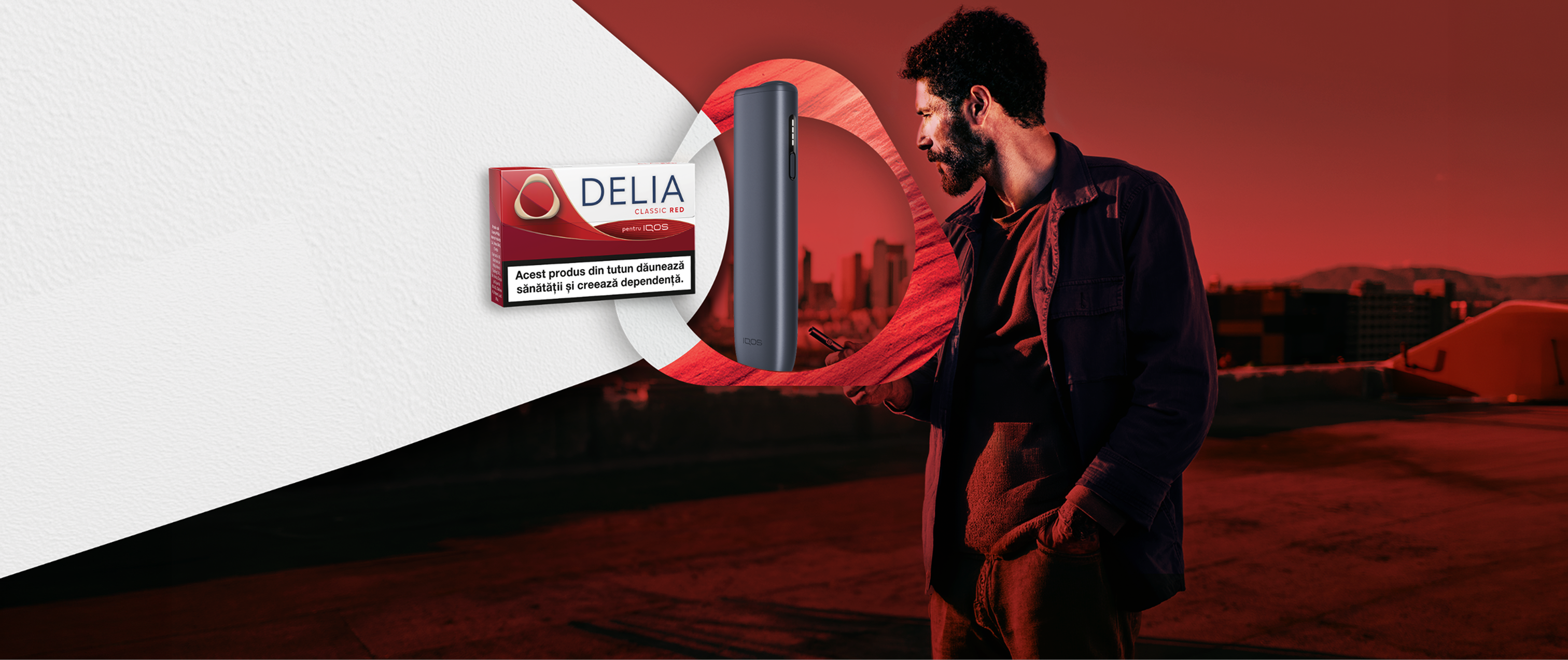 Imagine de fundal cu un barbat care priveste un oras, totul in nuante de rosu Delia Red