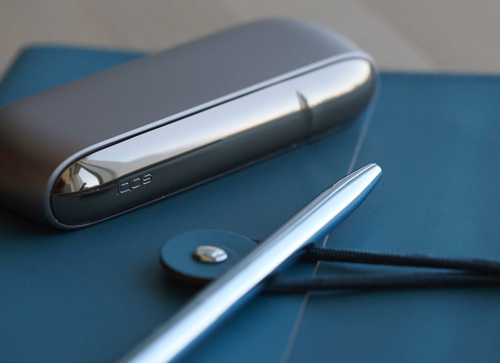 IQOS 3 next to coffee cups