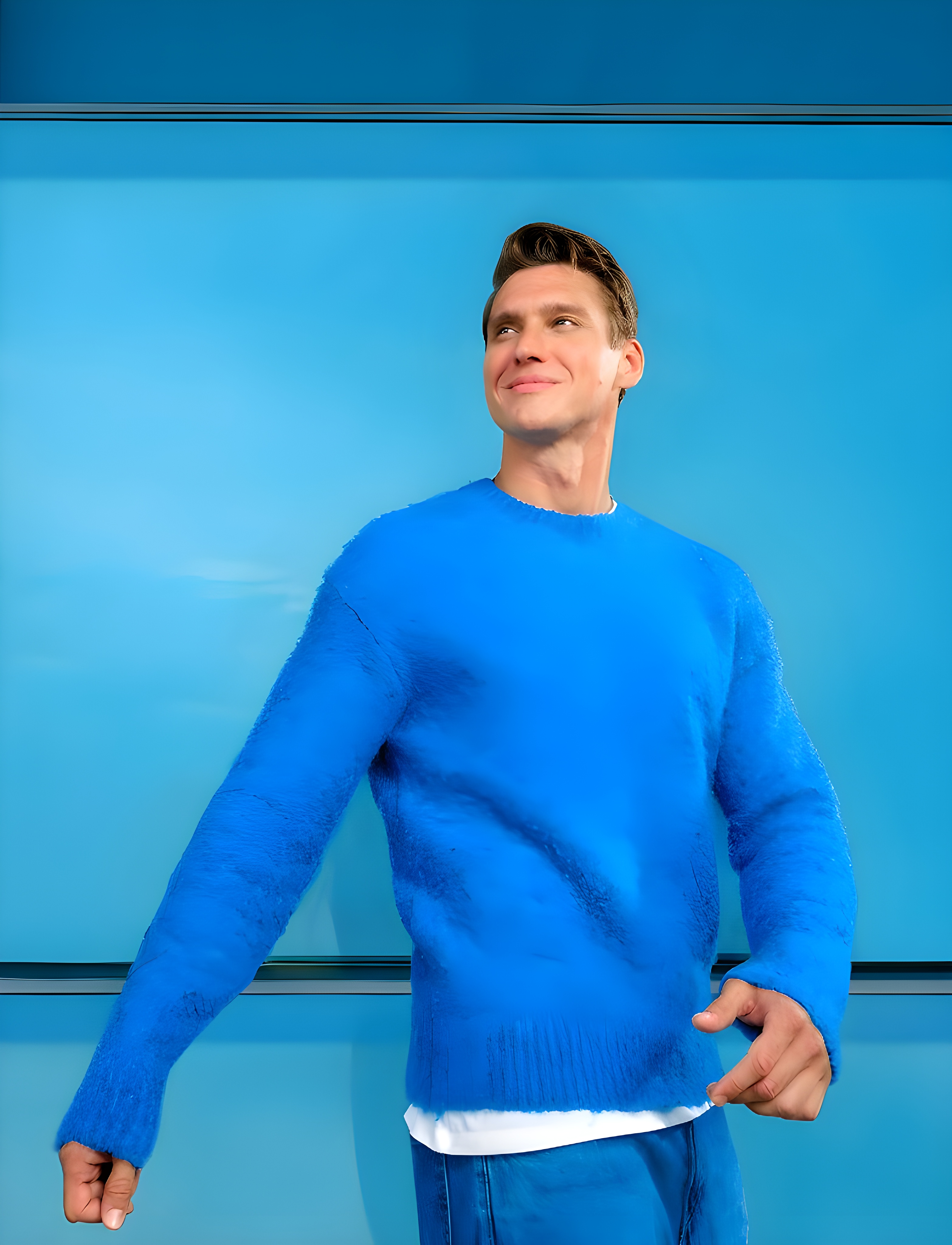 barbat cu bluza rosie, care ține în mână un dispozitiv IQOS ILUMA